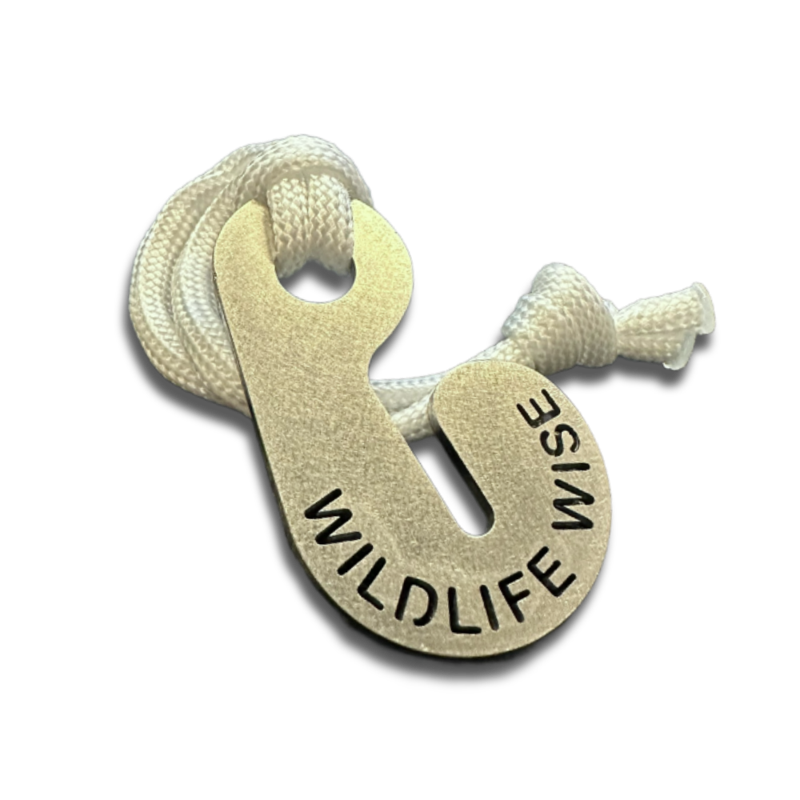 Stainless steel Poop Loop with WILDLIFE WISE cut through it, on a white cord